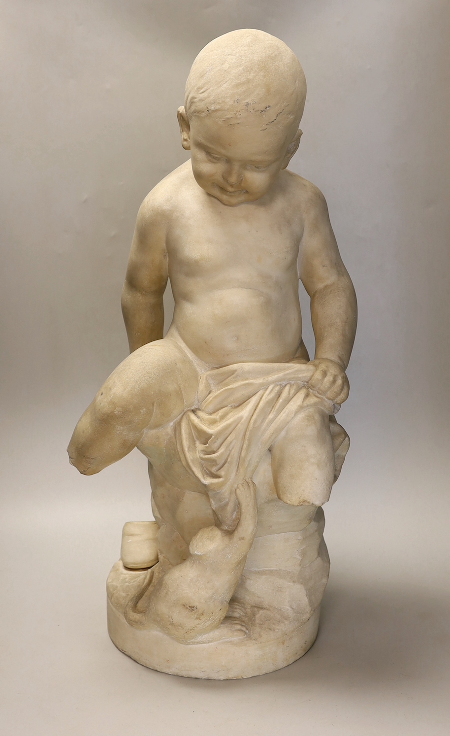 A 19th century French white marble carving of a boy and a cat, 60cm high
